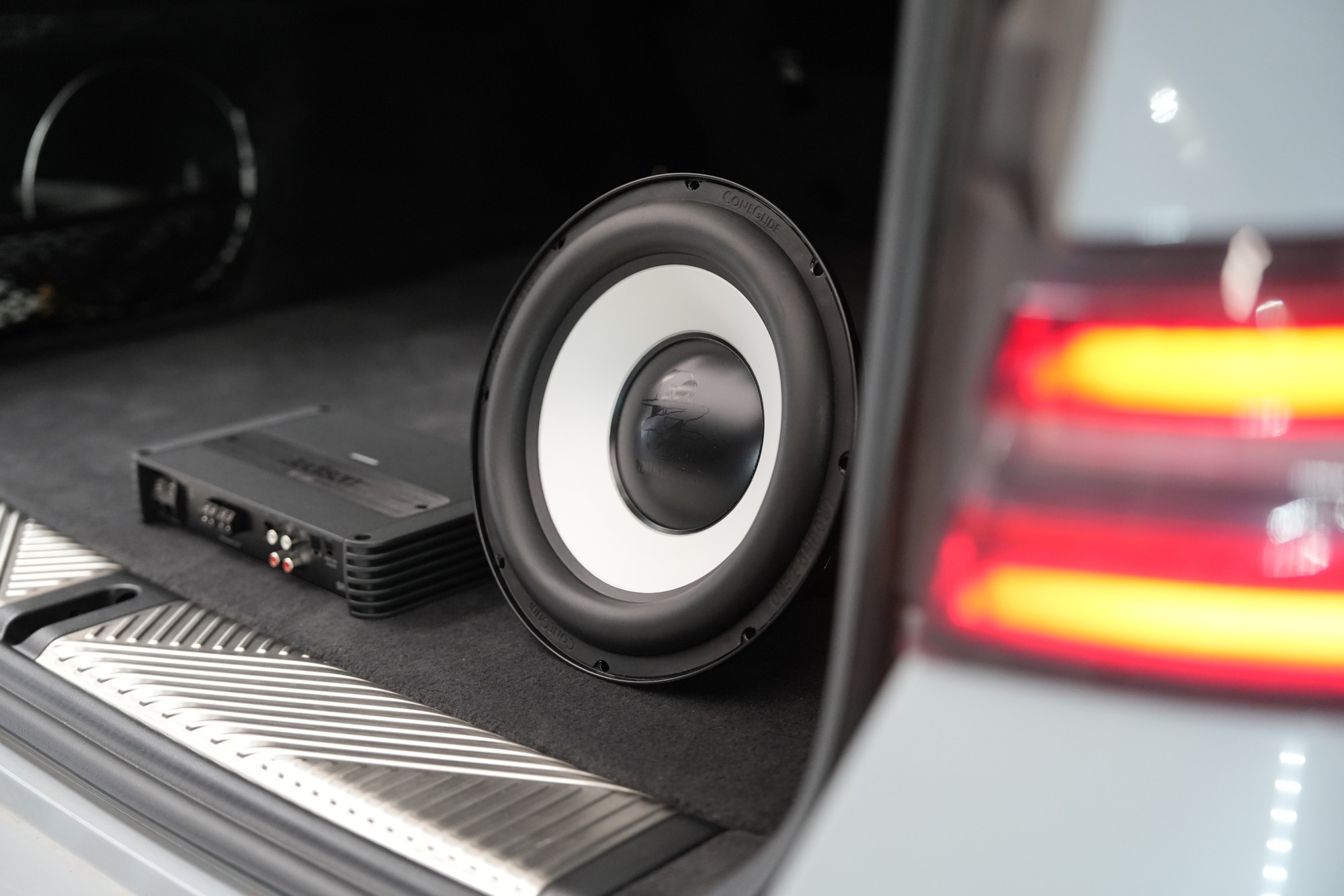 Why is a monoblock the most suitable solution for powering a subwoofer?